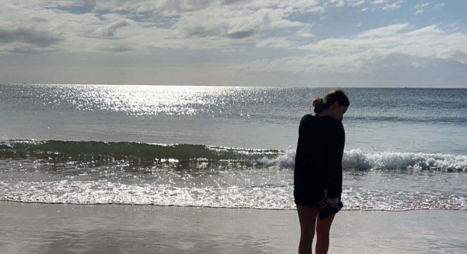 Child and dog enjoying the beach
